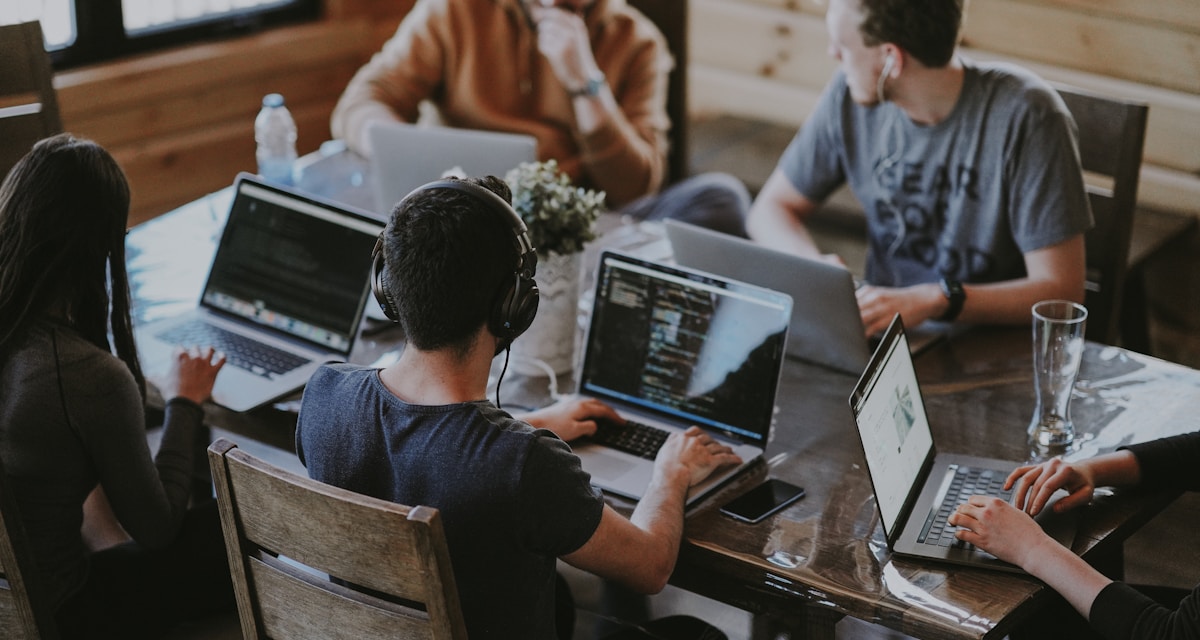 Team collaborating at a computer in the office